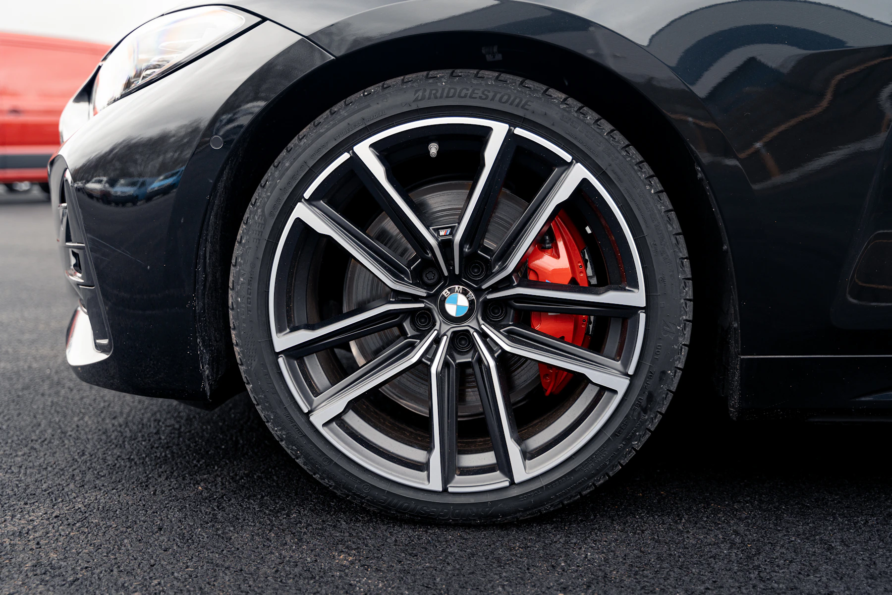 Close-up of the M Sport alloy wheel and red brake caliper